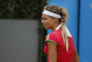 woman wearing red, white, and green jersey shirt