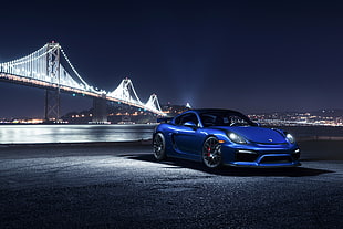blue sports coupe near Golden Gate Bridge digital wallpaper