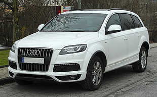 white Audi SUV on street