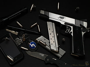 black and gray semi-automatic pistol, knife, gun, keys, ammunition