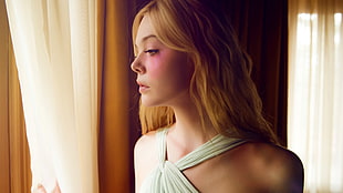 blonde hair woman in white halter dress peeking on window