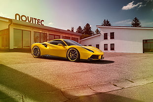 yellow sports car on gray concrete road HD wallpaper