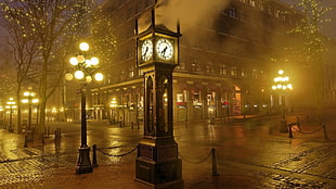 brown clock near road and lampposts HD wallpaper