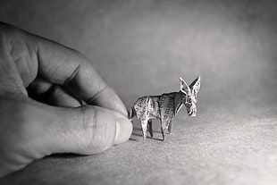 grayscale photo of animal figure, monochrome, paper, hands, origami