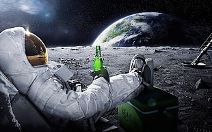astronaut lying on chair holding glass bottle photography