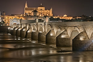 photo of concrete building near dock during night time, andalucia
