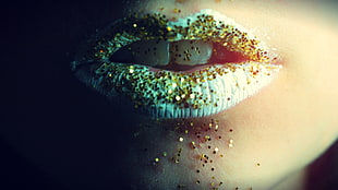 person wearing white lipstick with gold glitters on mouth