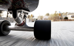 tilt shift lens photography of skateboard on road