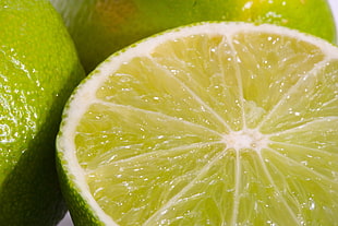 close-up photo of green sliced citrus