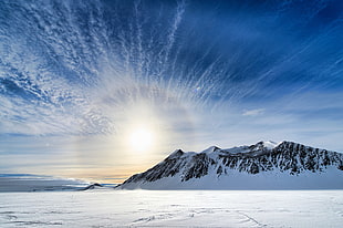 mountain coated by snow during daytime, antarctica