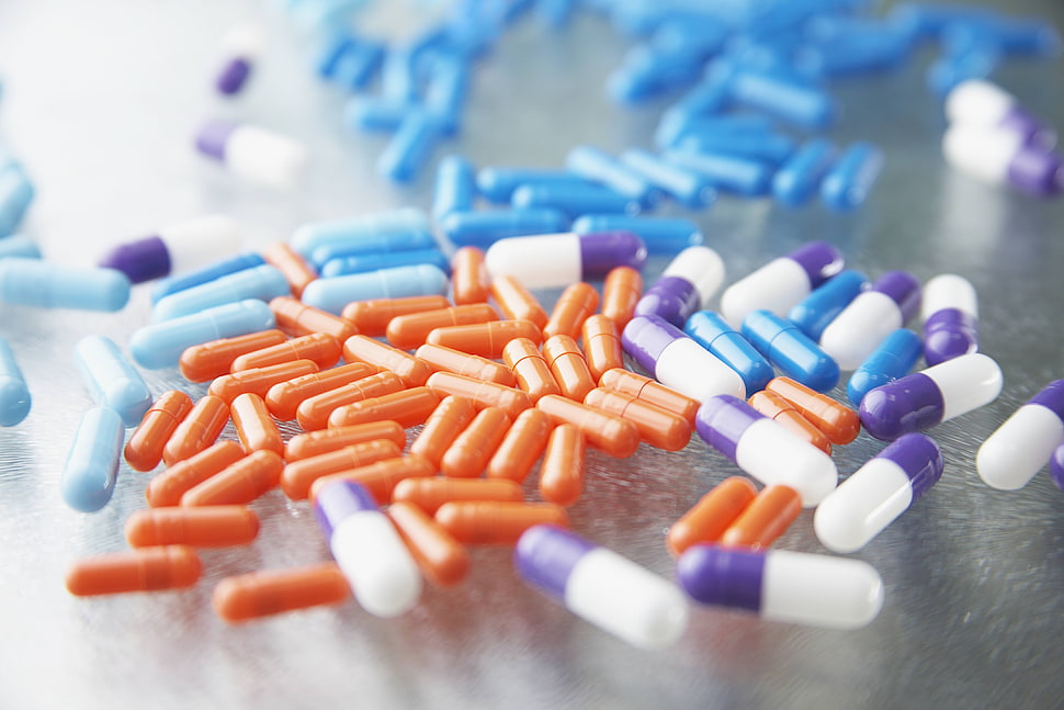orange, blue, and white medication pills HD wallpaper