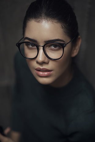 woman wearing black framed eyeglasses and black shirt