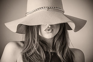 grayscale photography of woman wearing sunhat
