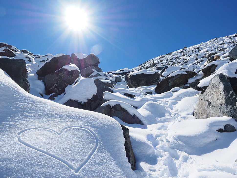 heart draw on snow filled mountain photo during daytime HD wallpaper