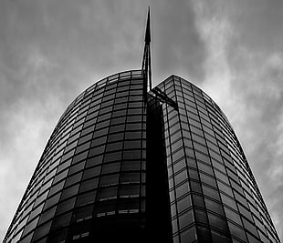 grayscale photography of building under cloud