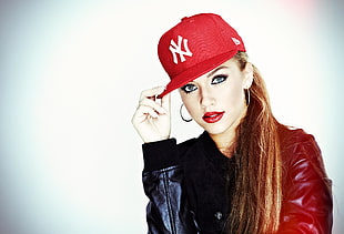 woman wearing red and white New York Yankees fitted cap