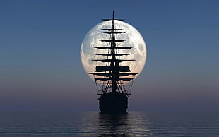 silhouette of full-rigged ship sailing at sea under moonlight at nighttime
