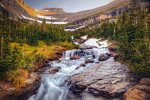 cascading river against mountain photo HD wallpaper