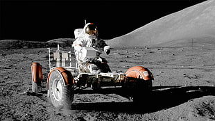 person on white astronaut suit on red truck