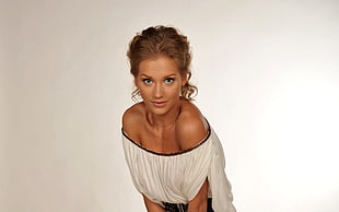 woman wearing white off-shoulder top