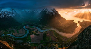mountain with river flowing during golden hour, sunset, Norway, field, road