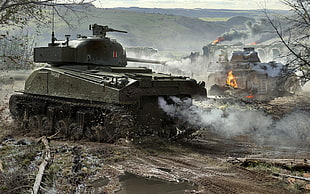 battle tank on open field beside trees near mountain during daytime