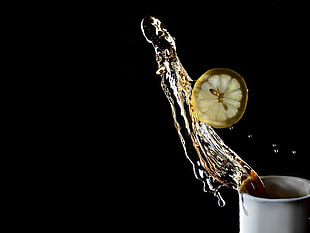 time lapse photography of water and slice lemon
