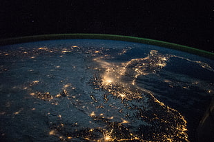 space photography of planet Earth during night