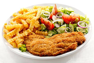 fried meat with fries and vegetables
