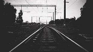 grayscale photo of train rail HD wallpaper
