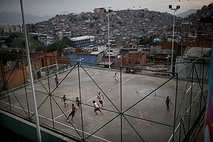 gray metal framed glass top table, city, street, soccer, favela