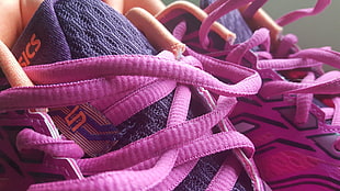 purple-and-pink ASICS athletic shoes