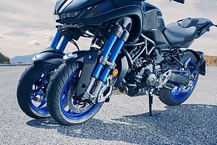 black and blue 3-wheel sports bike
