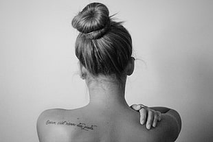 grayscale photo of back of woman