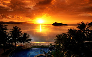 photo of golden hour, sunset, beach, sea, sunlight