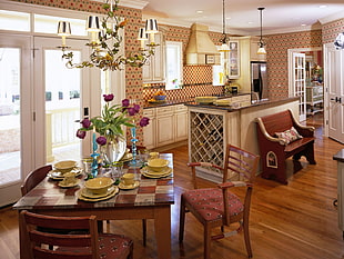 brown wooden dining set near kitchen inside house