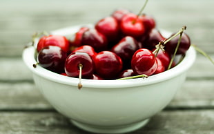 shallow focus photography of red cherries in bowl HD wallpaper