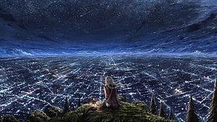 woman wearing brown dress sitting on green grass overlooking the city at nighttime