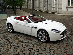 photo of white convertible coupe on street