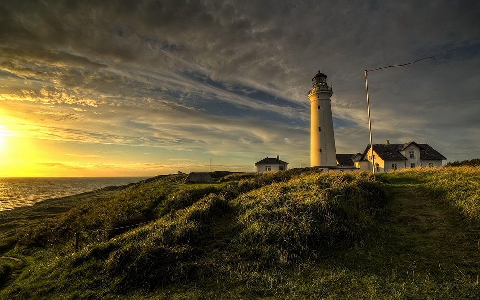 white lighthouse, lighthouse, water, sunset, grass HD wallpaper