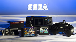 black Sega console with controller and game cartridges, Sega, retro games, vintage, Sonic the Hedgehog