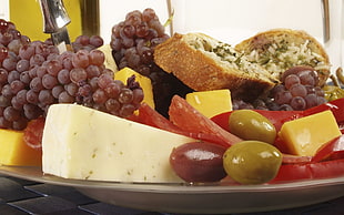 fruits and blue cheese on plate
