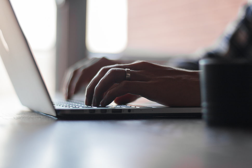 person in front of laptop computer HD wallpaper