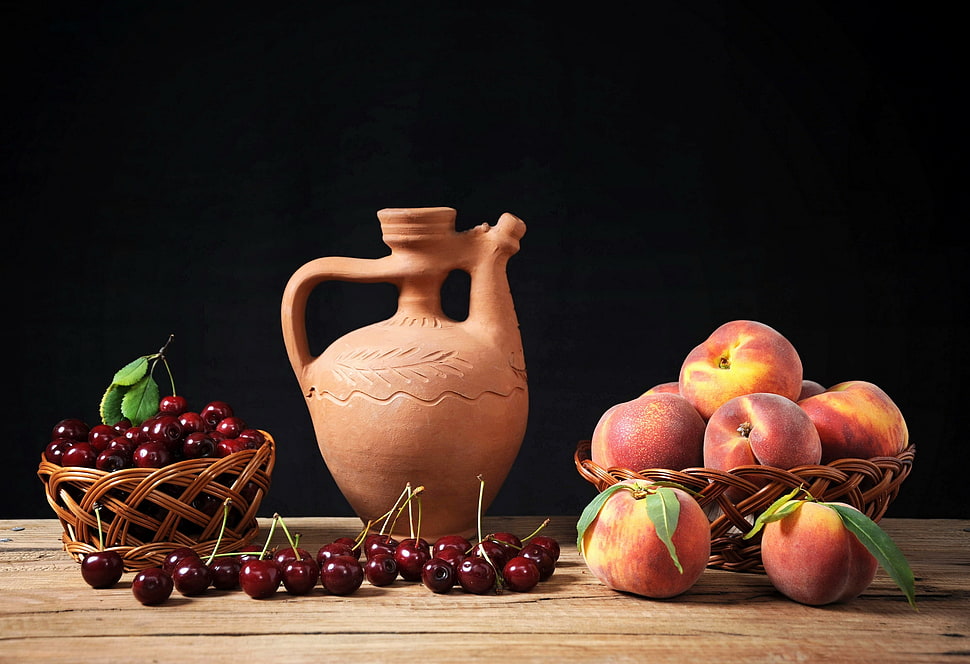 beige ceramic jar near grapes and apple fruits both on brown rattan basket HD wallpaper