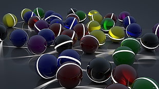 blue, red, and yellow balls with illumination