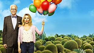 woman wearing pink cardigan holding assorted-colored balloons beside man in black suit jacket outfit HD wallpaper