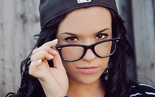 woman wearing black-framed eyeglasses
