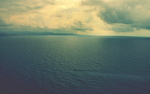 photo of an ocean, sea, clouds, glasses, landscape