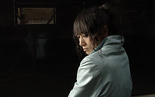 woman in white top inside darkroom