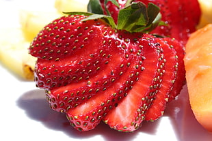 macro photography of slice strawberry HD wallpaper